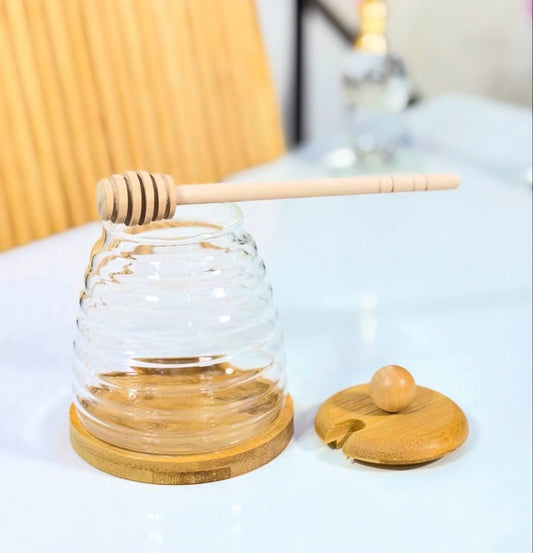 pot de miel avec cuillère en bois